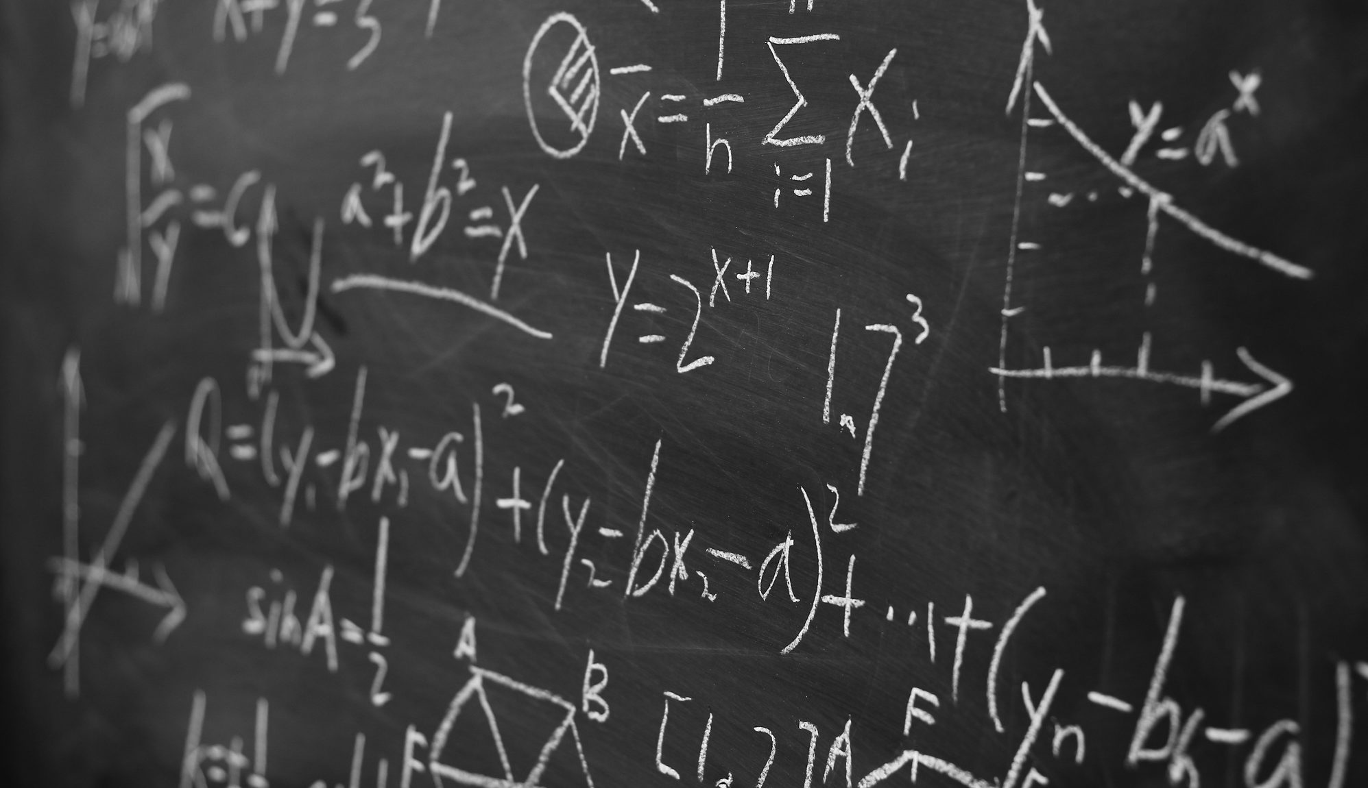 Maths formulas on chalkboard background