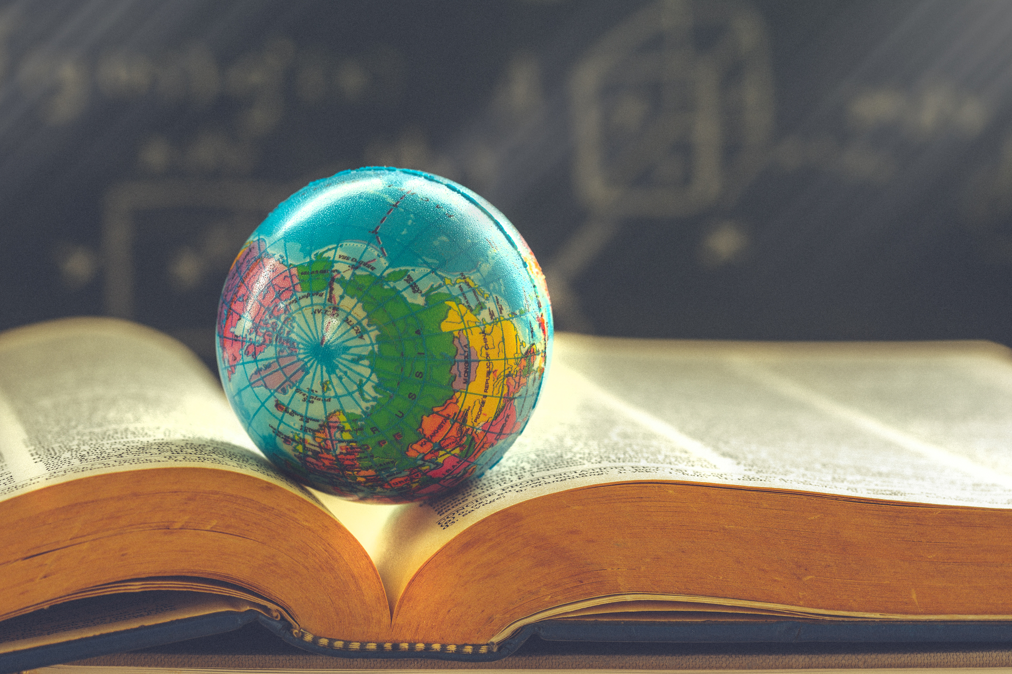 humanities education, globe on book