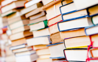 best books for stem students header, stacks of many books